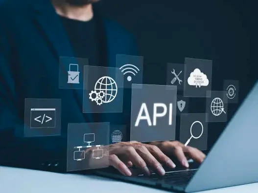 Hands typing on a laptop beneath floating interface panels with connection and settings icons