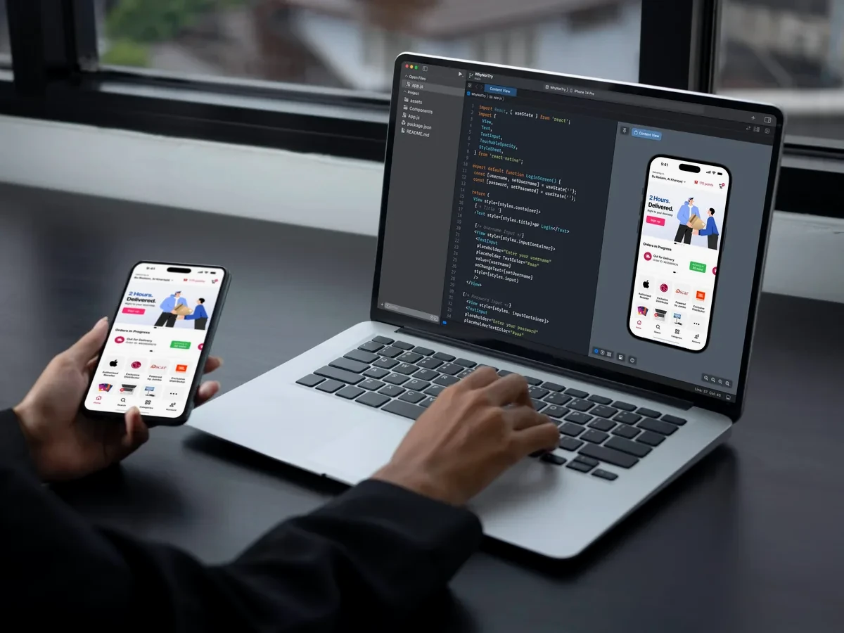 Person testing a shopping app on a phone beside a laptop showing the same app and its code